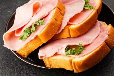 Ham sandwich slices of bread and pieces of ham fast food serving size natur.. Stock Photos