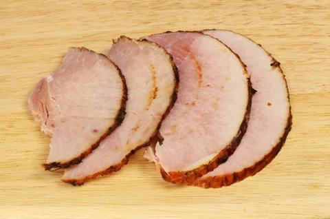 Ham slices on a board Stock Photos