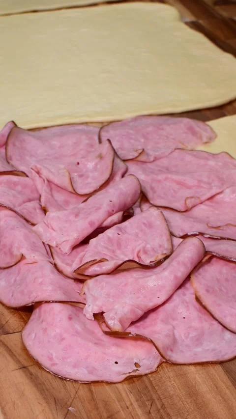 Ham Slices Neatly Placed on Dough for Delicious Venezuelan Ham Bread Stock Footage 332567527