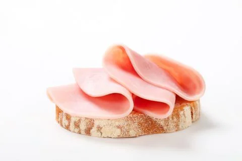 Ham slices on a round bread slice Stock Photos