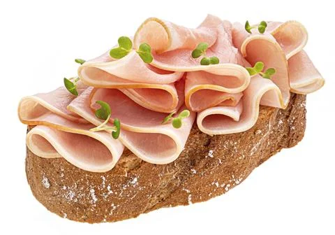 Ham slices on rye bread isolated on white background Stock Photos