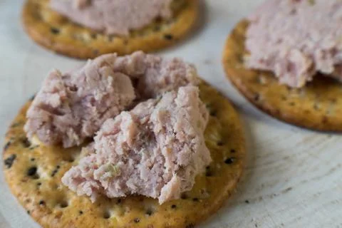 Ham spread on multi grain crackers Stock Photos