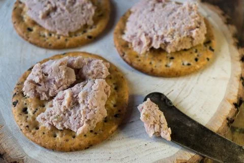 Ham spread on multi grain crackers Stock Photos