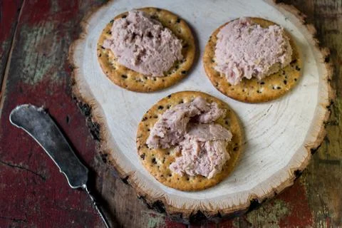 Ham spread on multi grain crackers Stock Photos