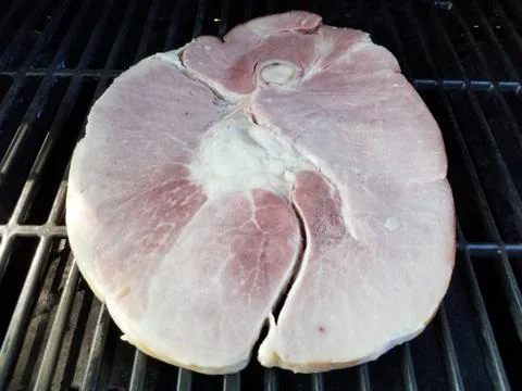 Ham steak on grill Stock Photos