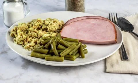 Ham with stuffing and  green beans Stock Photos