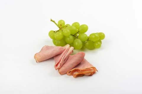 Ham with white grapes Foto stock