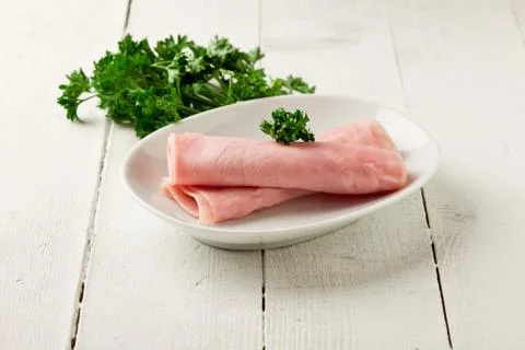 Ham on wooden table Stock Photos