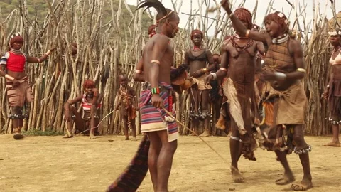 Hamar tribe during the Bull Jumping ceremony. Stock Footage 164384107