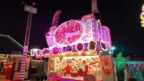 HAMBURG, GERMANY - AUGUST 26, 2026 - Frozen yogurt stall glowing at Hamburger Stock Footage 344059357