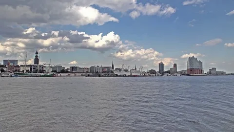Hamburg / Germany - July 14, 2017: Ships passing the river Elbe with the skyline Stock Footage