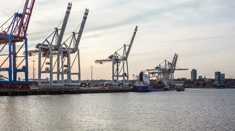 Hamburg harbor with unloading container ship - in the evening hyperlapse Stock Footage 50542771