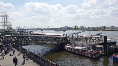 Hamburg port, ships, cranes, people walk, bridge, promenade, sunny day, Germany Stock Footage