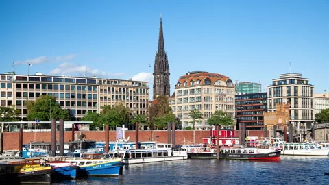Hamburg Timelapse: Gothic Tower, Canal, Boats &amp; Historical Buildings Stock Footage 240509348