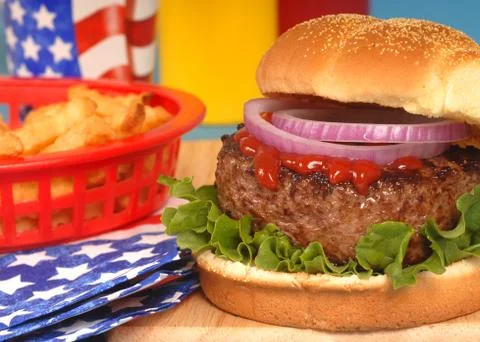 Hamburger in 4th of july setting Stock Photos