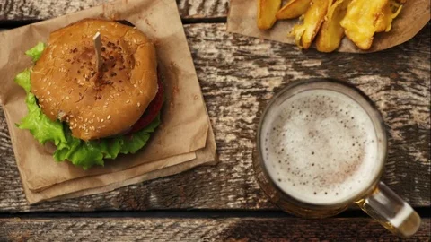 Hamburger and beer Stock Footage 81233369