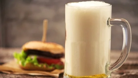 Hamburger and beer Stock Footage 81233548