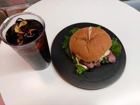 Hamburger and cola Stock Photos