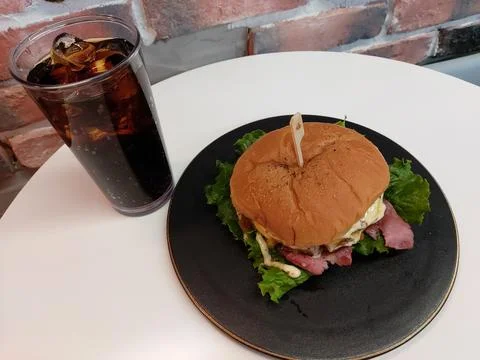 Hamburger and cola Stock Photos