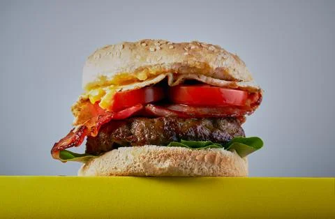 Hamburger with bacon and egg. Stock Photos