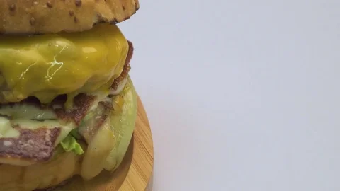 Hamburger with beef and cheddar on white background. Stock Footage 80567092