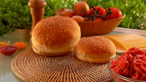 Hamburger bun falls on the table. Stock Footage 103412791
