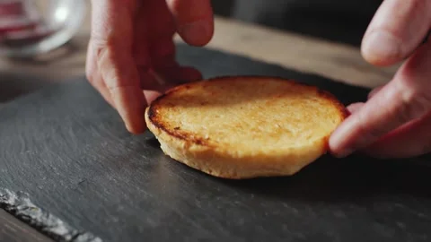 Hamburger Bun Preparation on a Rustic Slate Board 库存影片 331101203