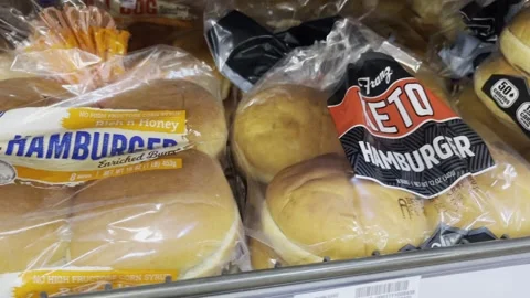 Hamburger buns on grocery shelf Stock Footage