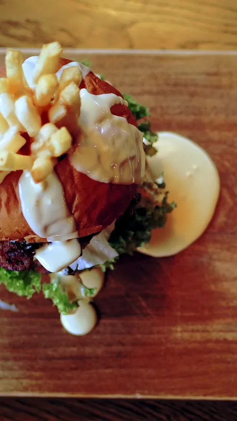Hamburger, burger. close-up. top view. a juicy, tasty, freshly prepared, fatty Stock Footage 320609741