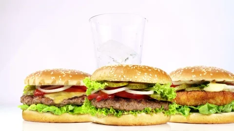 Hamburger, Cheeseburger and Fishburger - Fast Food with Coke Stock Footage 164393225