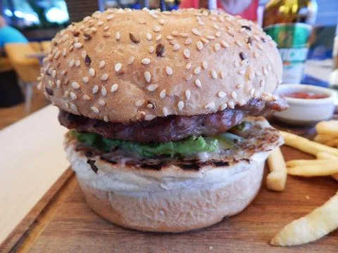 Hamburger  closeup on wooden rustic table Stock Photos