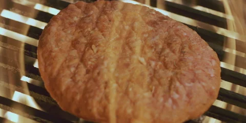 Hamburger cooked on the grill 스톡 동영상 247386111