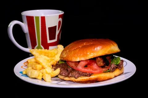 A hamburger with a dark background Stock Photos