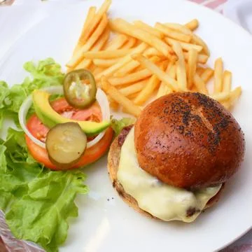 Hamburger on dish Stock Photos