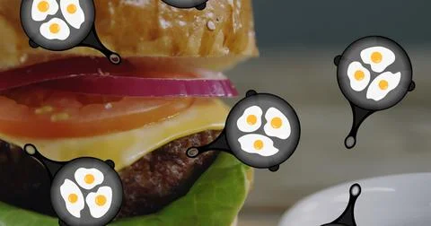 A hamburger with eggs floating around it rests on plate Stock Illustration