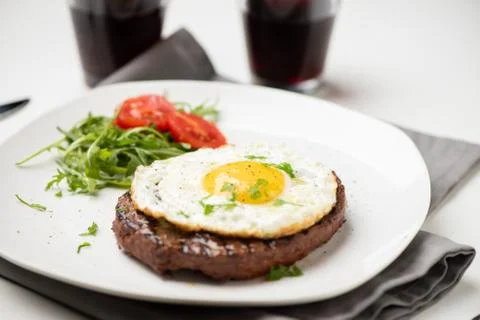 Hamburger with fried egg closeup Stock Photos