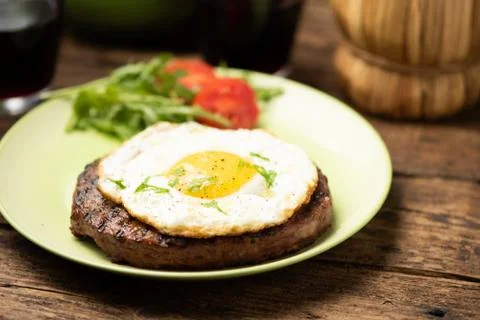 Hamburger with fried egg closeup Stock Photos