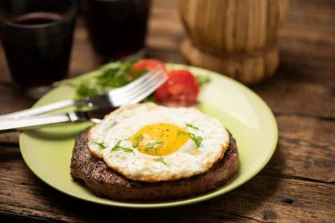 Hamburger with fried egg closeup Stock Photos
