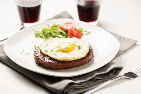 Hamburger with fried egg closeup Stock Photos