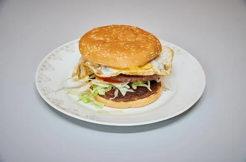 A hamburger with a fried egg on top Stock Photos