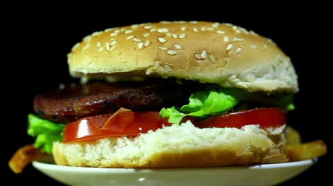 Hamburger with fried potato in rotation close up Stock Footage 35995154
