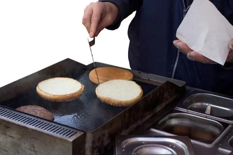Hamburger on grill Stock Photos