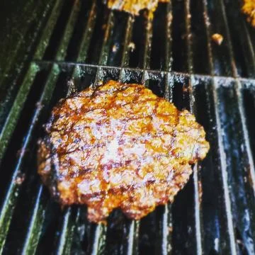Hamburger grilling Stock Photos