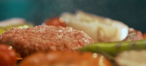 Hamburger meat falling on fire pan Stock Footage 311833782