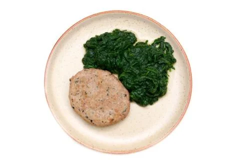 Hamburger meat with spinach on white background seen from above Stock Photos