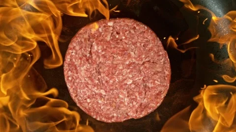 Hamburger Minced Raw Beef Steak Falling on Frying Pan with Flames. Stock Footage 304495679
