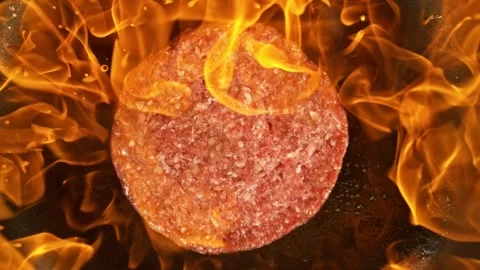 Hamburger Minced Raw Beef Steak Falling on Frying Pan with Flames. Stock Footage 304504981