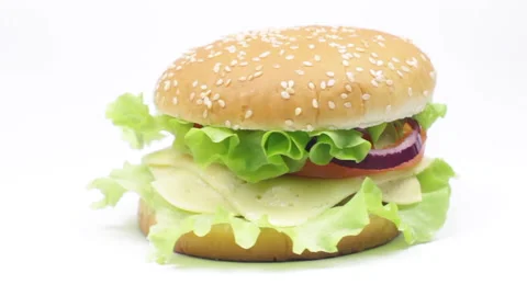 A hamburger or cheeseburger rotating on white background Stock Footage 233426422