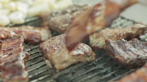 Hamburger patty on the grilling pan with open flames Stock Footage 64285108