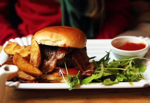 Hamburger on plate with salad Stock Photos